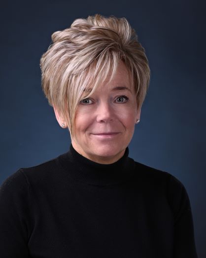 Headshot of Board Member Karen Cook in a black top