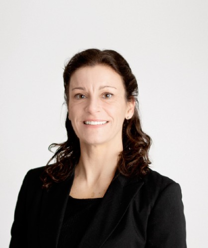 Headshot of Board Member Sara Inch in a black shirt and jacket