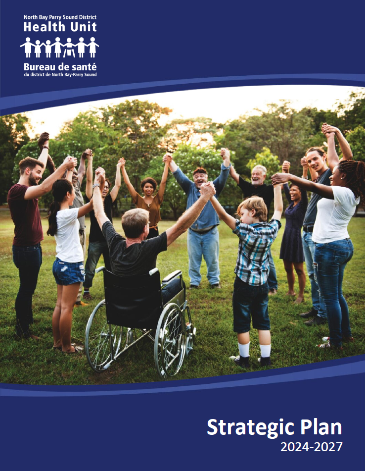 People standing in a circle holding hands