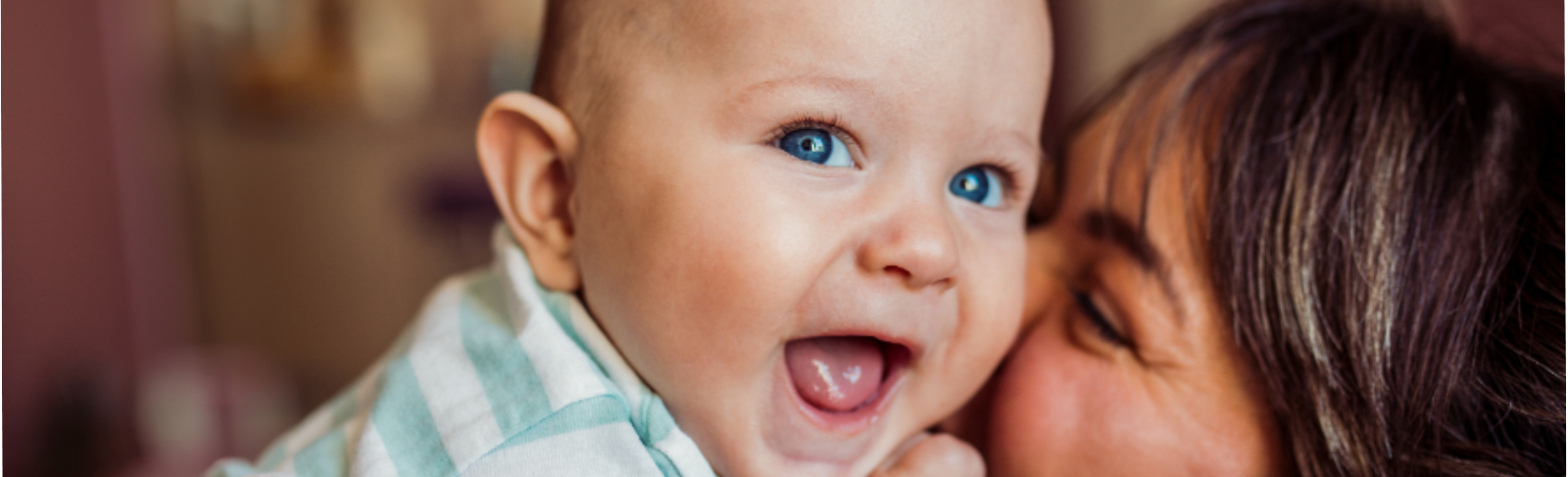 Mother and baby looking at each other and smiling