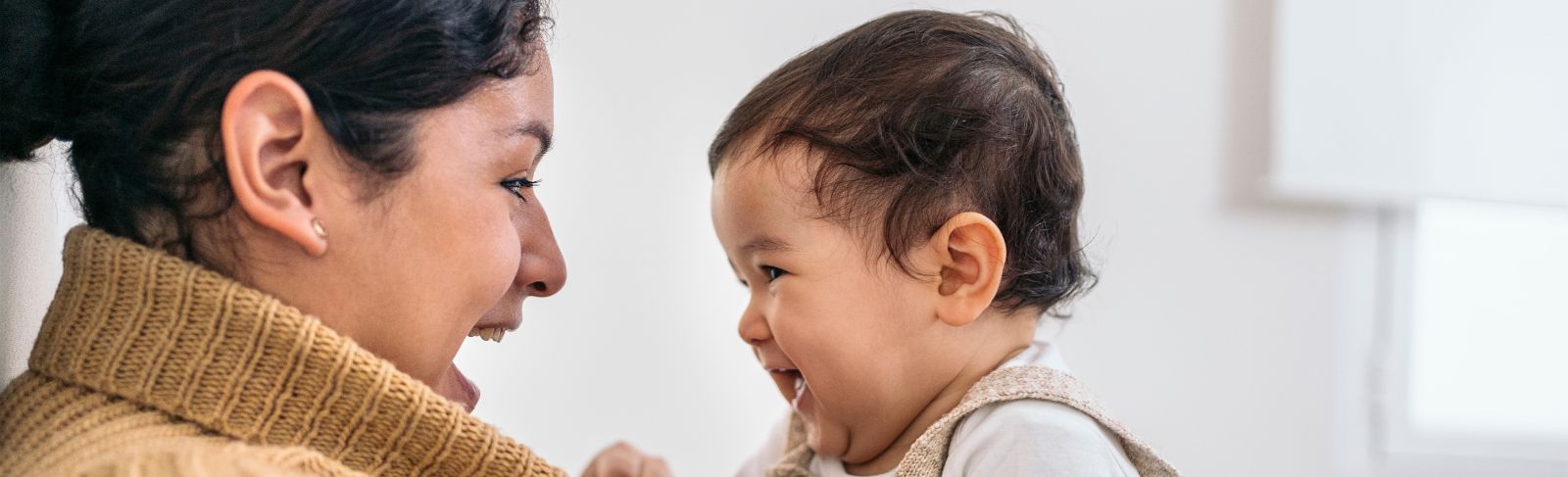 Mother and baby looking at each other and smiling
