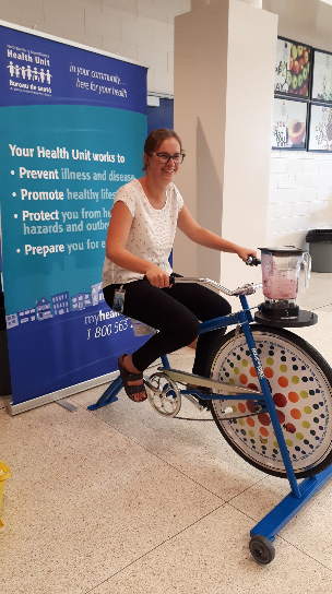 Blender bike woman sitting on a stationary bicycle