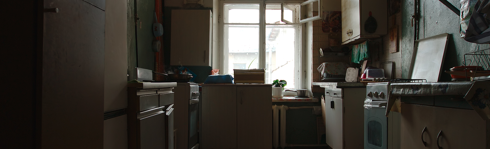 A galley kitchen in an apartment.