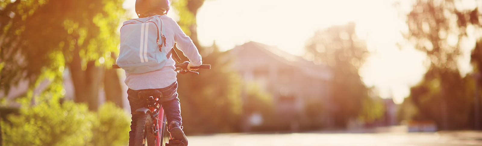 boy biking to school