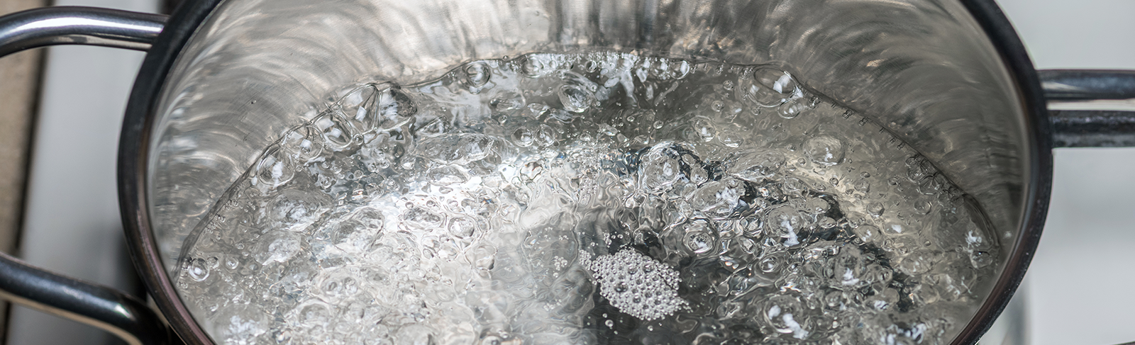 Water boiling in a put on a stove.