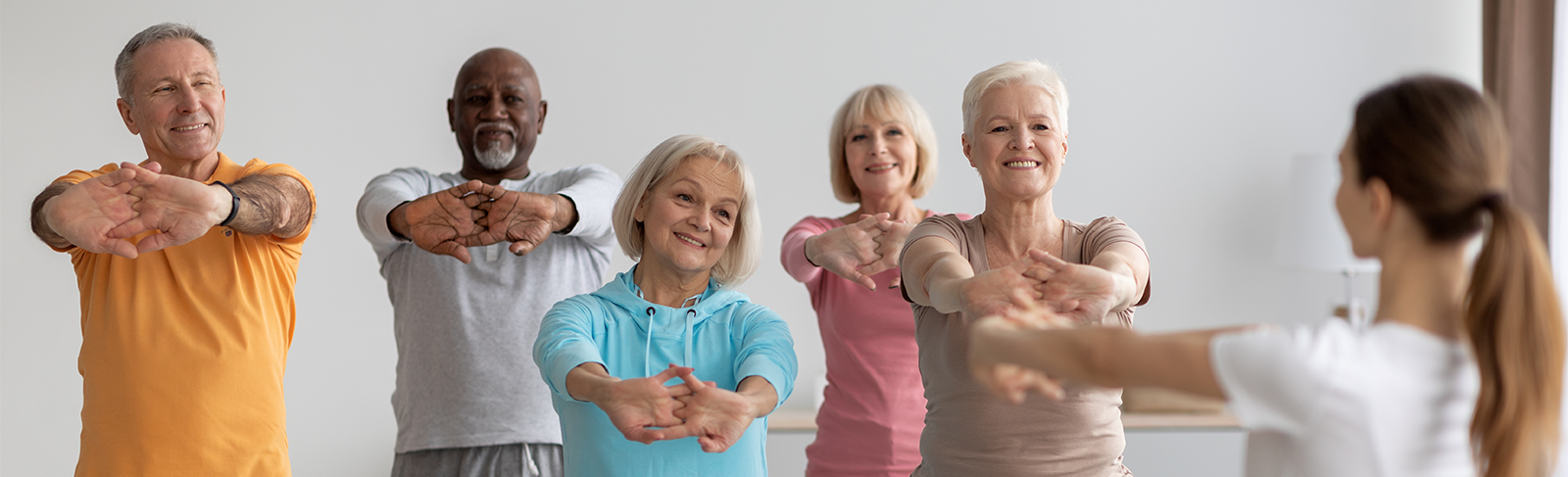 Older adults stretching their hands