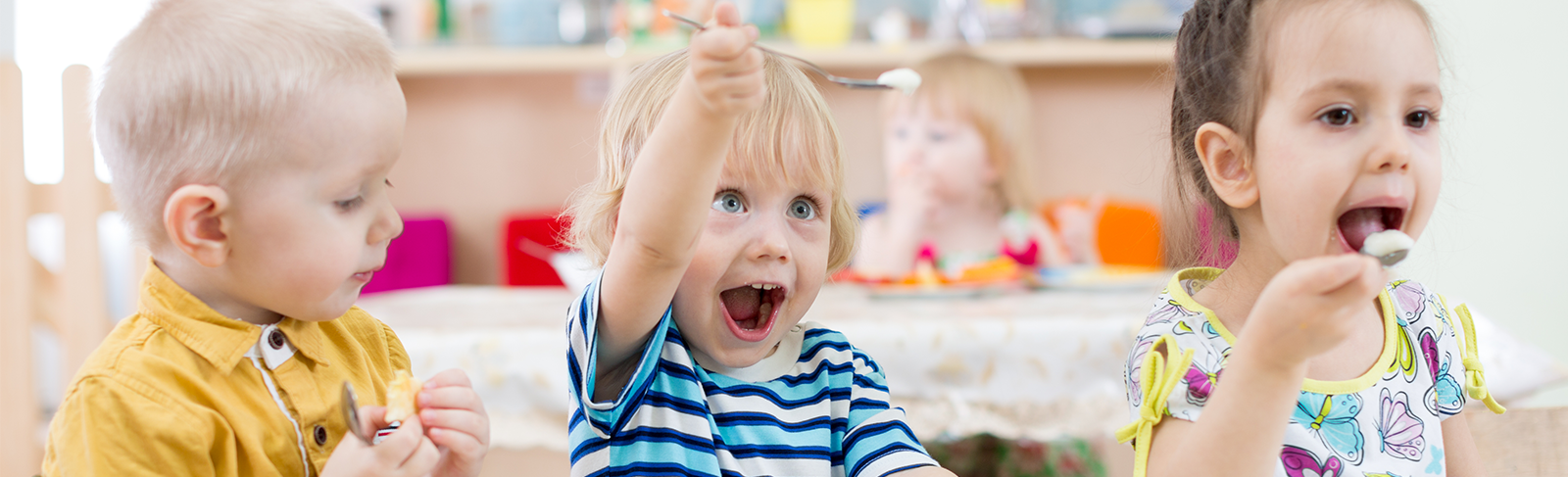 Three children eating