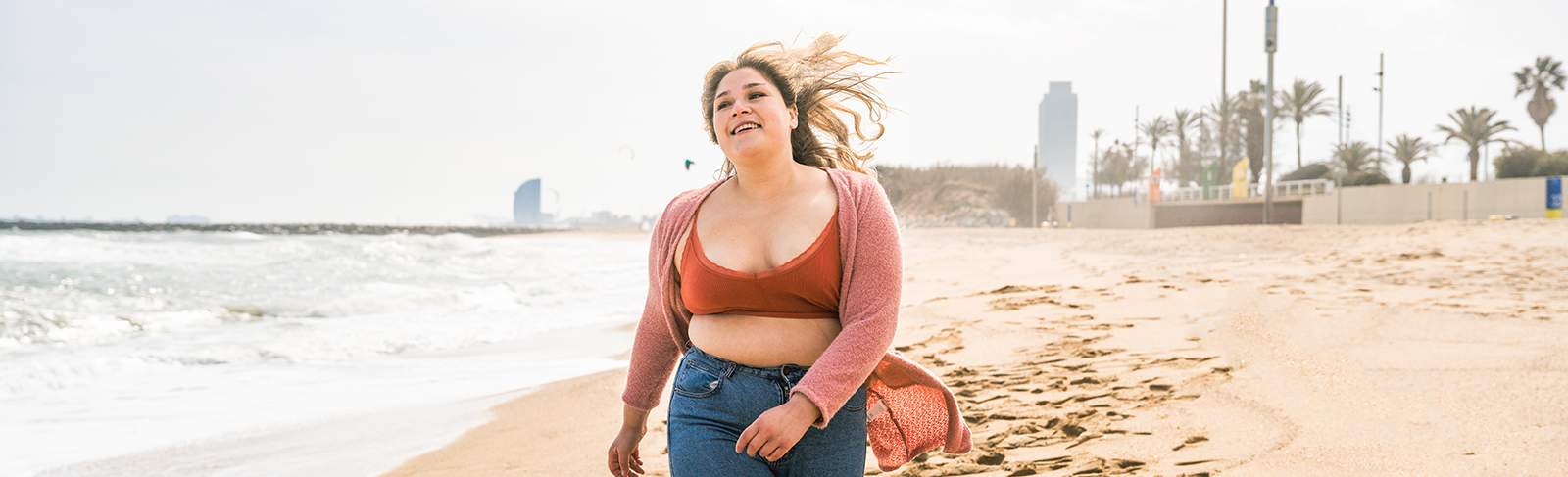 lady walking on the beach