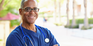 Image of a doctor outside, with stethoscope around neck