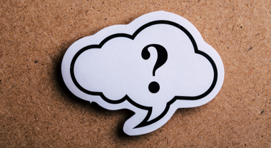 Thought bubble on a bulletin board with question mark inside
