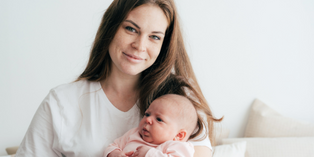 Image of a parent holding a baby