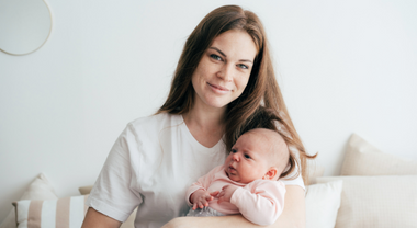 An adult holding a baby