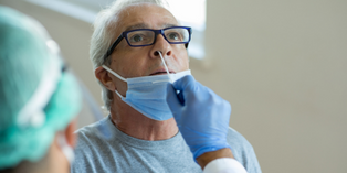 Image of someone having their nose swabbed