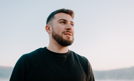 Young white man looking out toward horizon