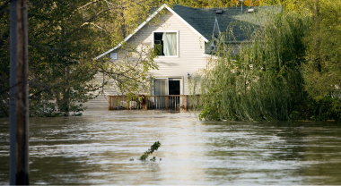 Exterior image of a house surrounded by high-level water 