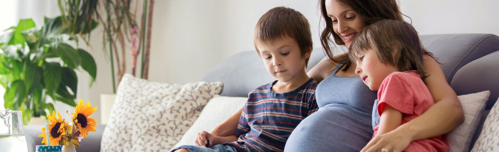 Pregnant mother and two children