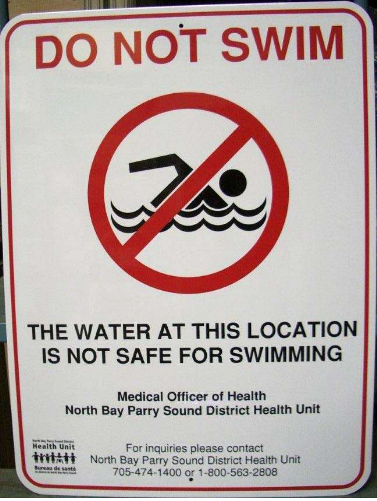 Warning sign that reads, "DO NOT SWIM. The water at this location is not safe for swimming." Image to indicate that swimming is not allowed.