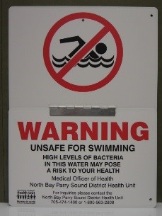 Unsafe swimming signage indicating water is unsafe for swimming