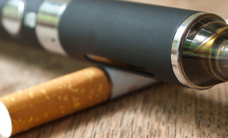 Image of a vape overlapping a cigarette