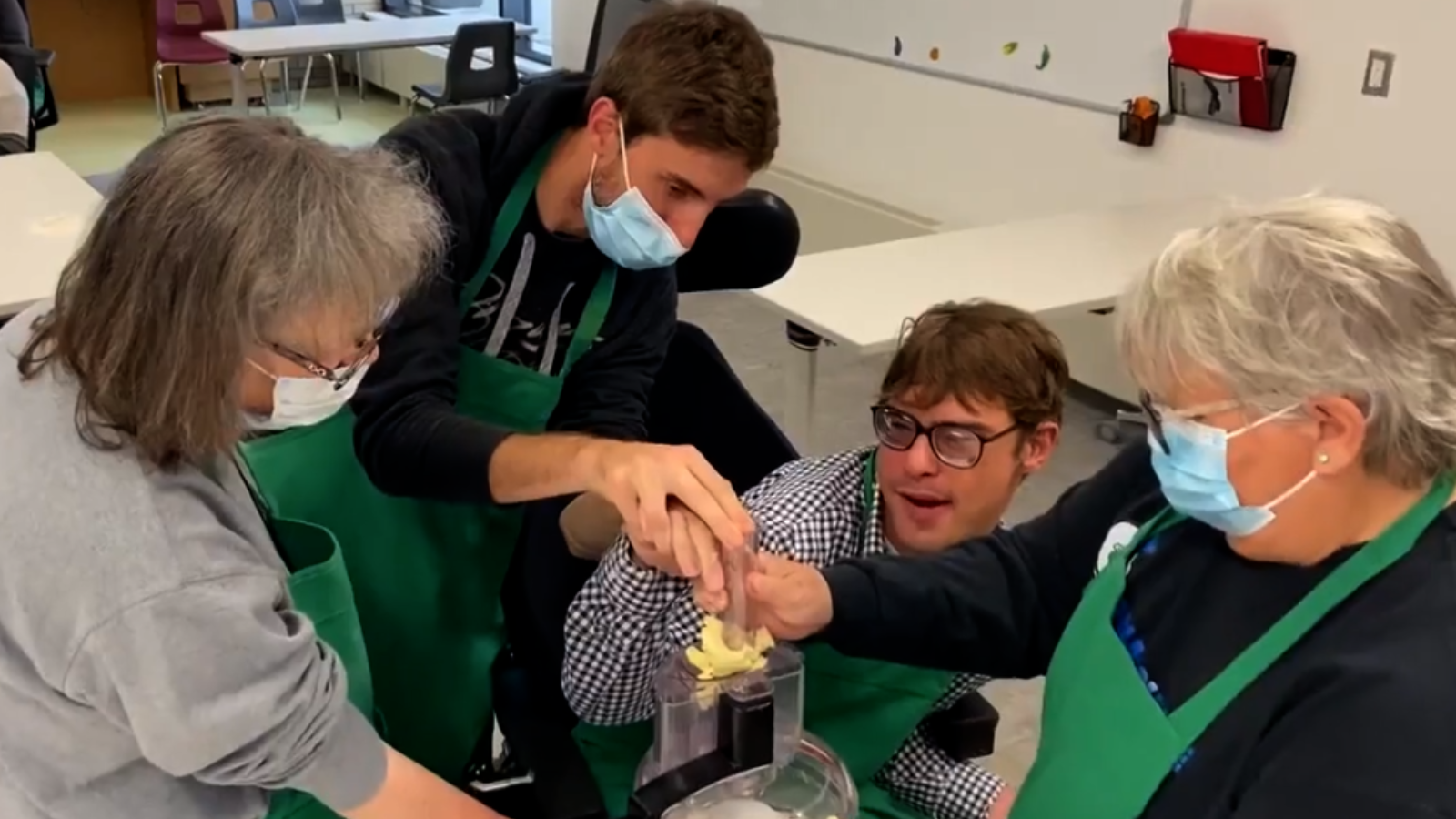 Group of people working together to prepare food