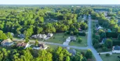 Aerial view of a neighborhood with many healthy trees
