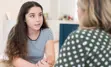Young girl speaking with a lady