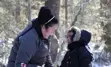 Indigenous child and young adult playing outdoors together in winter